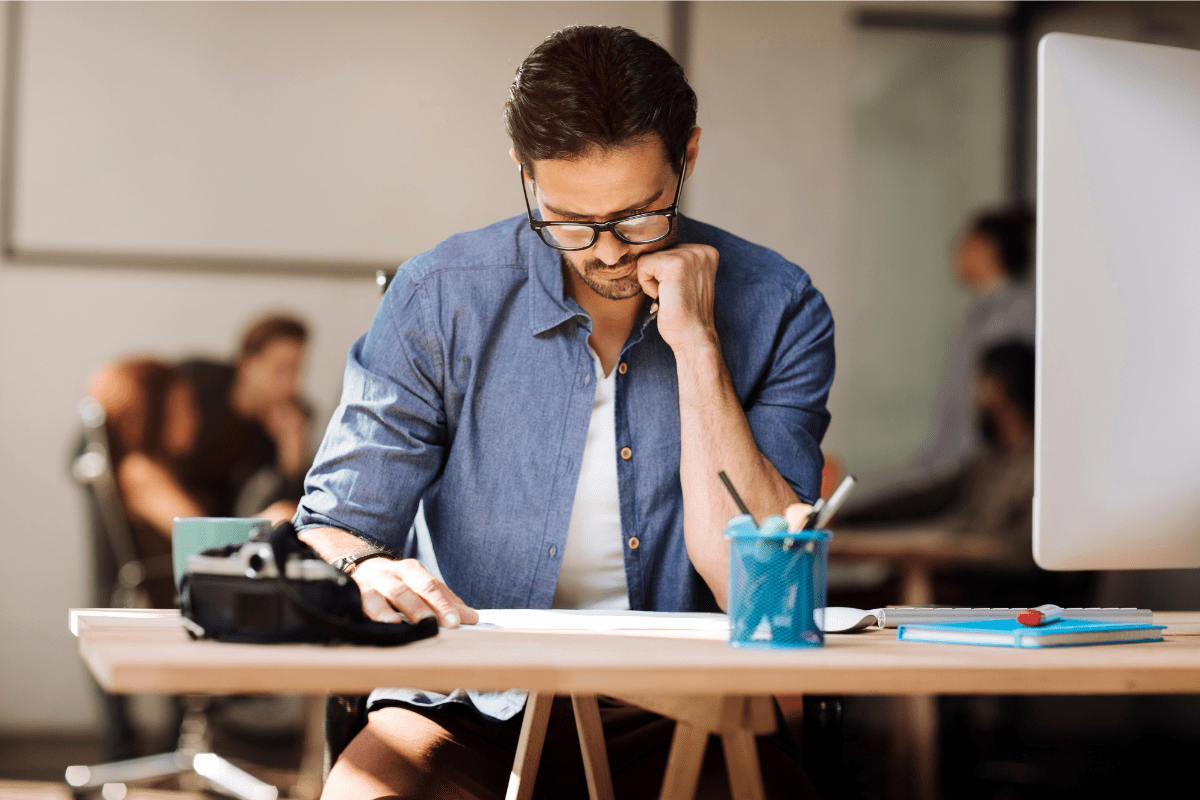 Young man focusing on his work at the office.