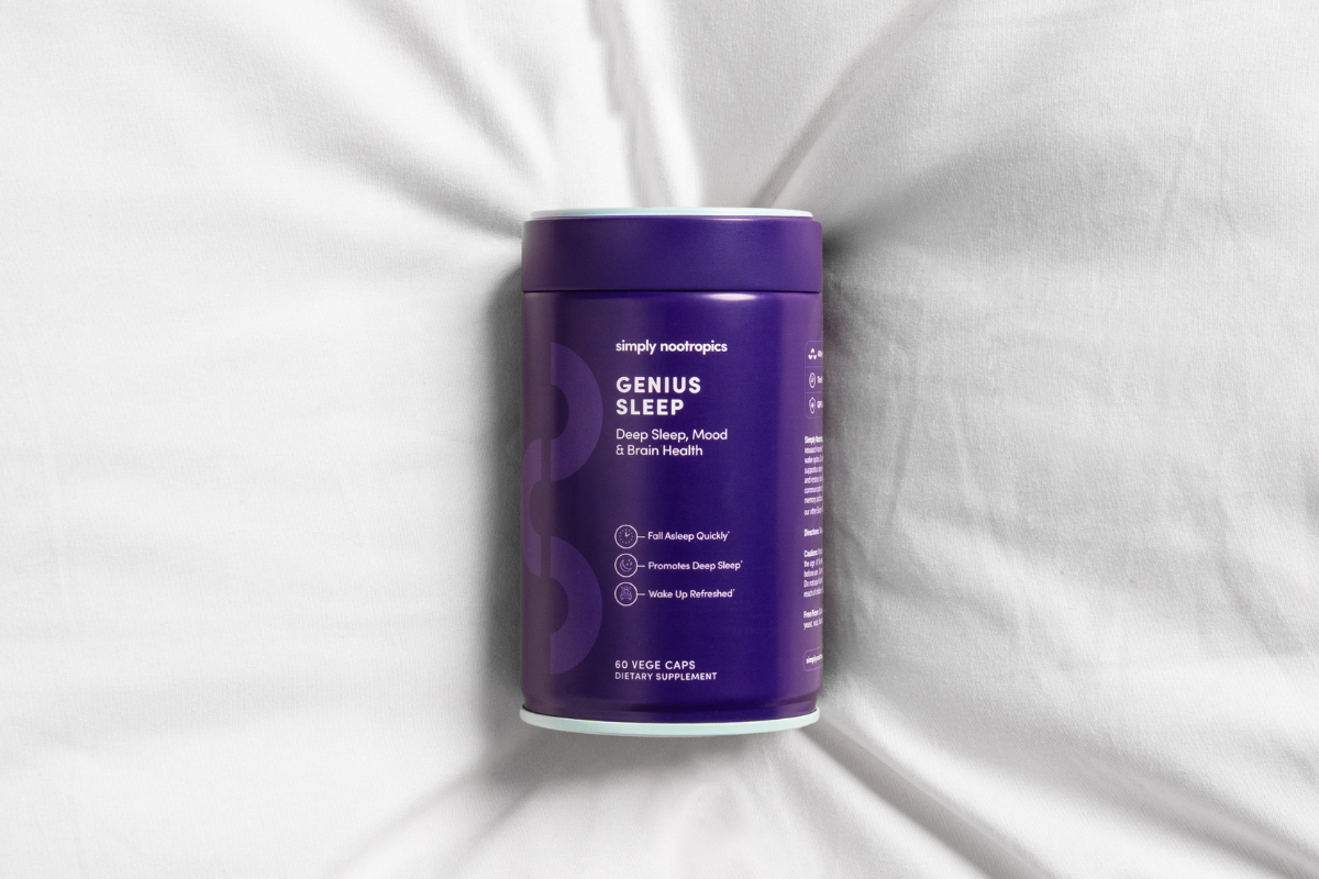Simply Nootropics Genius Sleep supplement bottle on white bedding.