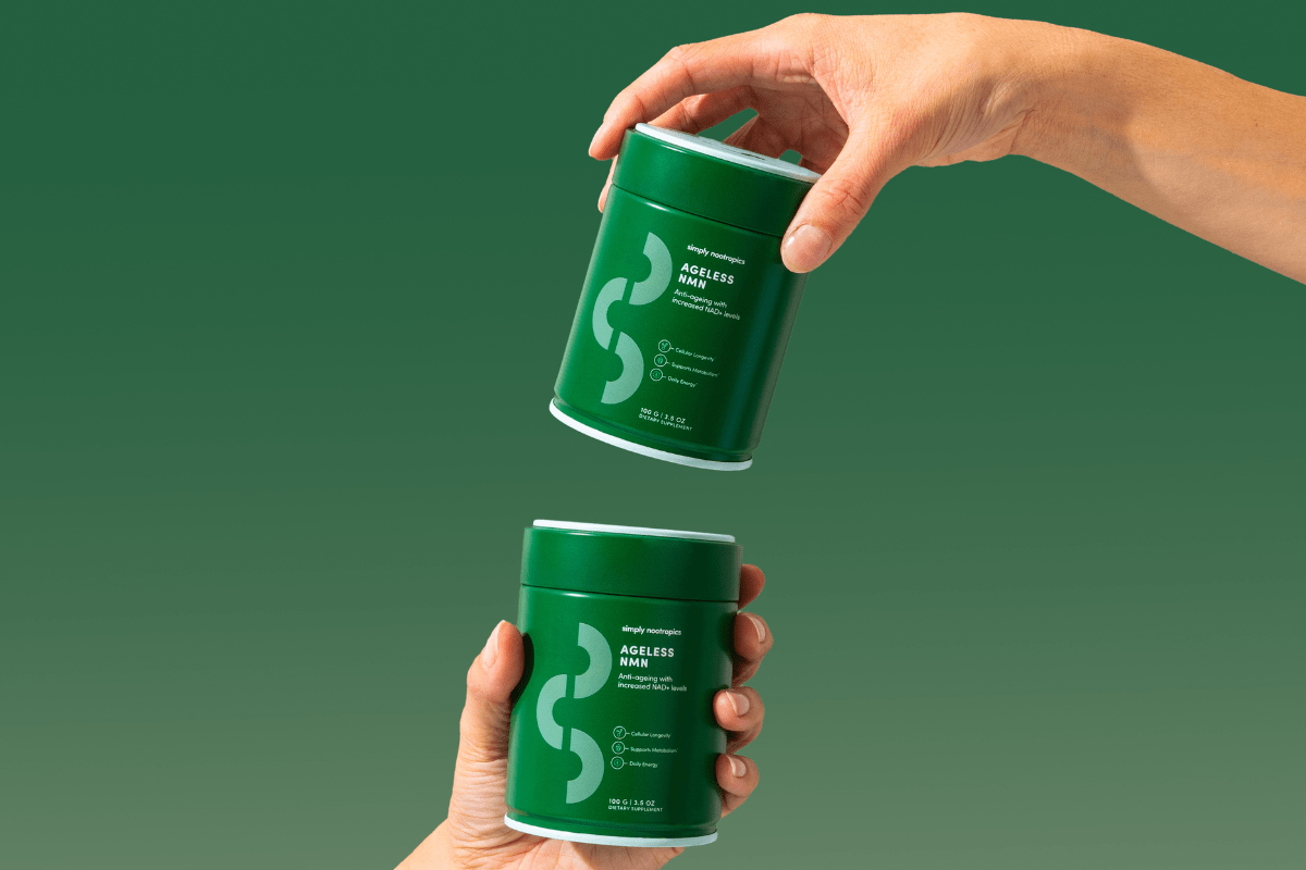 Hands passing a green jar of Ageless NMN supplement by Simply Nootropics.