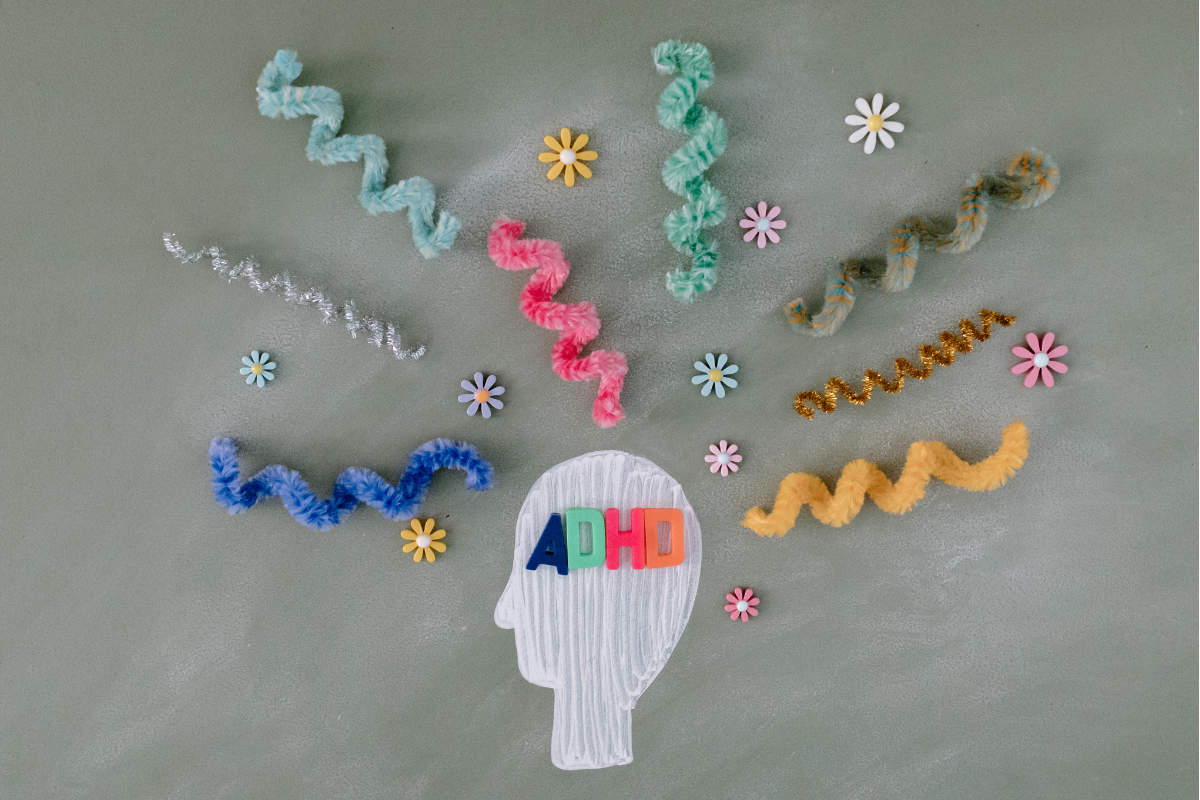 Colourful representation of ADHD with a silhouette head labelled 