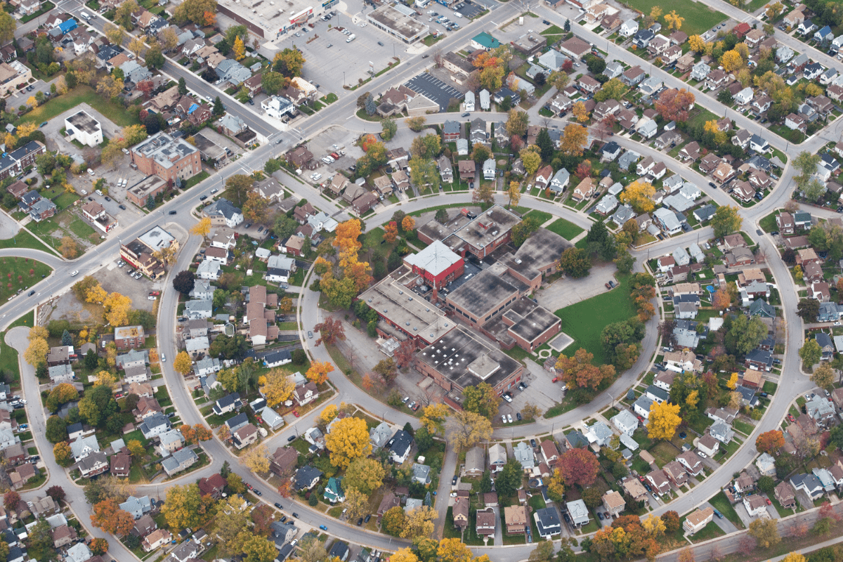 Aerial view of a circular neighbourhood with houses.