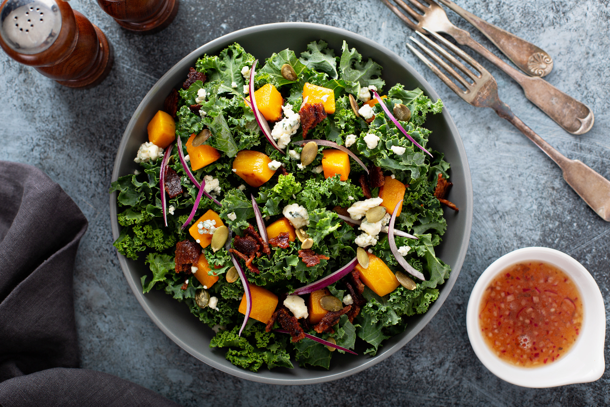 Kale salad with roasted butternut squash and goat cheese